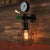 1-Light Water-Tap Wall Light Industrial Black and Green Metal Wall Mounted Lamp with Gauge and Cage Black Clearhalo 'Art deco wall lights' 'Cast Iron' 'Glass' 'Industrial wall lights' 'Industrial' 'Middle century wall lights' 'Modern' 'Rustic wall lights' 'Tiffany' 'Traditional wall lights' 'Wall Lamps & Sconces' 'Wall Lights' Lighting' 1949909