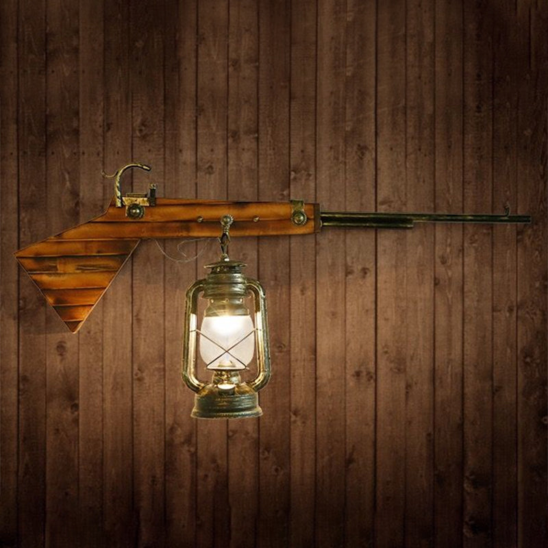 1 Bulb Lantern Wall Mounted Light Fixture Coastal Bronze Clear Glass Lighting with Gun Decoration Clearhalo 'Art deco wall lights' 'Cast Iron' 'Glass' 'Industrial wall lights' 'Industrial' 'Middle century wall lights' 'Modern' 'Rustic wall lights' 'Tiffany' 'Traditional wall lights' 'Wall Lamps & Sconces' 'Wall Lights' Lighting' 1959419
