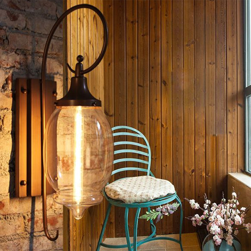 One Bulb Clear Glass Sconce Light Industrial Black Oval Shade Living Room Wall Lamp Clearhalo 'Art deco wall lights' 'Cast Iron' 'Glass' 'Industrial wall lights' 'Industrial' 'Middle century wall lights' 'Modern' 'Rustic wall lights' 'Tiffany' 'Traditional wall lights' 'Wall Lamps & Sconces' 'Wall Lights' Lighting' 1959441