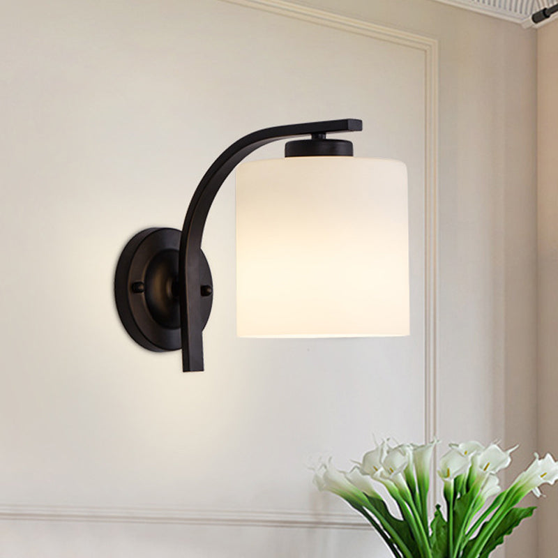 Black 1-Light Wall Sconce Simple Ivory Glass Cylinder Wall Mounted Lamp with Curved Arm Black Clearhalo 'Wall Lamps & Sconces' 'Wall Lights' Lighting' 1960422