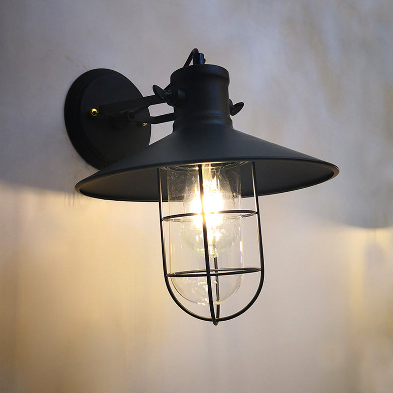 1-Light Conic Adjustable Wall Light Industrial Black Iron Sconce Lamp with Capsule Cage and Clear Glass Shade Clearhalo 'Art deco wall lights' 'Cast Iron' 'Glass' 'Industrial wall lights' 'Industrial' 'Middle century wall lights' 'Modern' 'Rustic wall lights' 'Tiffany' 'Traditional wall lights' 'Wall Lamps & Sconces' 'Wall Lights' Lighting' 1969656