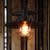 Single-Bulb Saucer Pendulum Light Industrial Black Iron Ceiling Pendant with Cage and Clear Glass Shade Black Clearhalo 'Art Deco Pendants' 'Black' 'Cast Iron' 'Ceiling Lights' 'Ceramic' 'Crystal' 'Industrial Pendants' 'Industrial' 'Metal' 'Middle Century Pendants' 'Pendant Lights' 'Pendants' 'Rustic Pendants' 'Tiffany' Lighting' 1969696