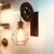 Farmhouse Ball Cage Wall Light 1-Light Iron Pulley Wall Mounted Light Fixture in Rust Red Rust Red Clearhalo 'Art deco wall lights' 'Cast Iron' 'Glass' 'Industrial wall lights' 'Industrial' 'Middle century wall lights' 'Modern' 'Rustic wall lights' 'Tiffany' 'Traditional wall lights' 'Wall Lamps & Sconces' 'Wall Lights' Lighting' 1971186