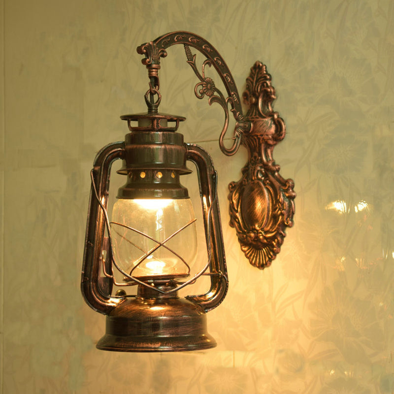Clear Glass Kerosene Wall Light Fixture Nautical 1 Head Restaurant Wall Sconce with Curved Arm Copper C Clearhalo 'Art deco wall lights' 'Cast Iron' 'Glass' 'Industrial wall lights' 'Industrial' 'Middle century wall lights' 'Modern' 'Rustic wall lights' 'Tiffany' 'Traditional wall lights' 'Wall Lamps & Sconces' 'Wall Lights' Lighting' 2011498