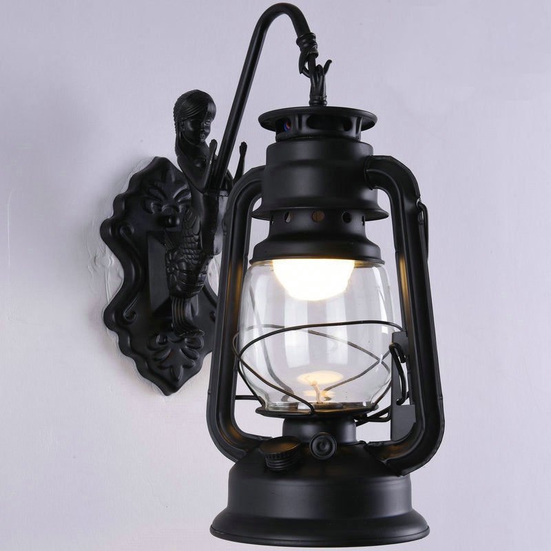 Clear Glass Kerosene Wall Light Fixture Nautical 1 Head Restaurant Wall Sconce with Curved Arm Black A Clearhalo 'Art deco wall lights' 'Cast Iron' 'Glass' 'Industrial wall lights' 'Industrial' 'Middle century wall lights' 'Modern' 'Rustic wall lights' 'Tiffany' 'Traditional wall lights' 'Wall Lamps & Sconces' 'Wall Lights' Lighting' 2011499