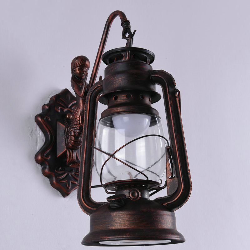 Clear Glass Kerosene Wall Light Fixture Nautical 1 Head Restaurant Wall Sconce with Curved Arm Copper A Clearhalo 'Art deco wall lights' 'Cast Iron' 'Glass' 'Industrial wall lights' 'Industrial' 'Middle century wall lights' 'Modern' 'Rustic wall lights' 'Tiffany' 'Traditional wall lights' 'Wall Lamps & Sconces' 'Wall Lights' Lighting' 2011501