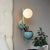 Macaron Sphere Wall Lighting Opal Glass 1 Bulb Bedroom Sconce Light with Metal Dome Pot Blue Clearhalo 'Cast Iron' 'Glass' 'Industrial' 'Modern wall lights' 'Modern' 'Tiffany' 'Traditional wall lights' 'Wall Lamps & Sconces' 'Wall Lights' Lighting' 2024508