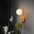 Macaron Sphere Wall Lighting Opal Glass 1 Bulb Bedroom Sconce Light with Metal Dome Pot Yellow Clearhalo 'Cast Iron' 'Glass' 'Industrial' 'Modern wall lights' 'Modern' 'Tiffany' 'Traditional wall lights' 'Wall Lamps & Sconces' 'Wall Lights' Lighting' 2024509