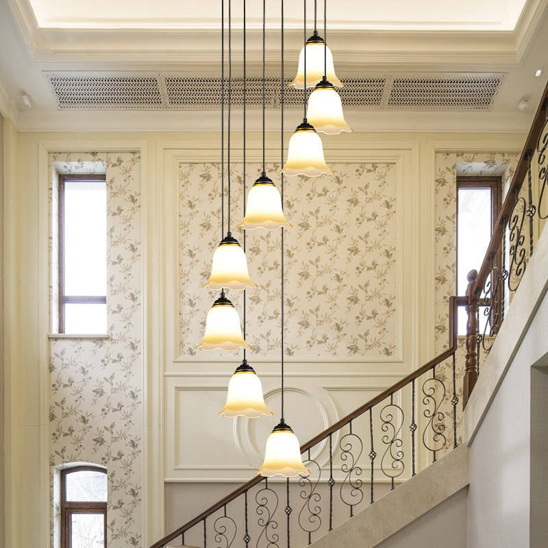 Flower Stairs Multi Pendant Light Frosted Glass Minimalist Suspension Lighting in Black with Round Canopy 8 Black Round Clearhalo 'Ceiling Lights' 'Modern Pendants' 'Modern' 'Pendant Lights' 'Pendants' Lighting' 2025568