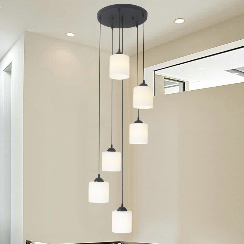 Modernism Cylinder Cluster Pendant Opal Glass Stairs Pendulum Light in Black with Round Canopy Clearhalo 'Ceiling Lights' 'Modern Pendants' 'Modern' 'Pendant Lights' 'Pendants' Lighting' 2025669