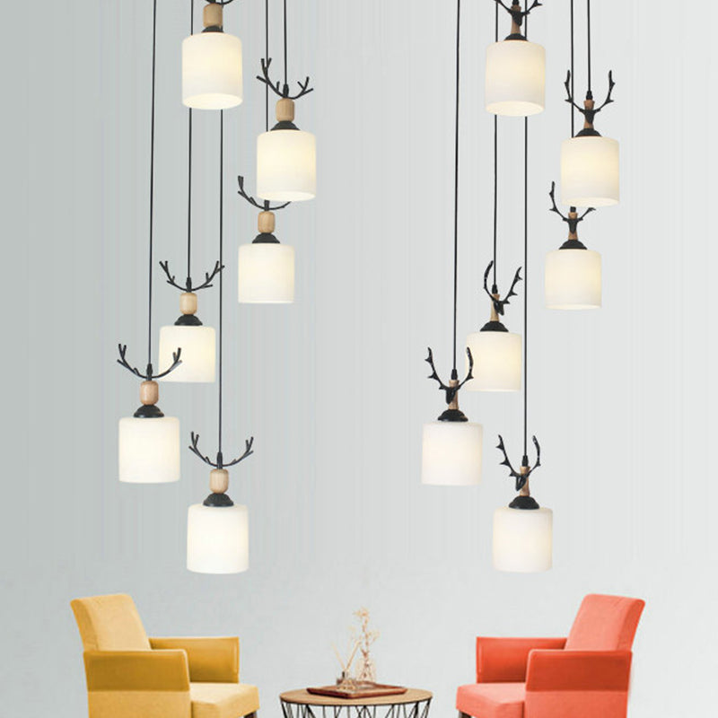 Modernism Cylinder Cluster Pendant Opal Glass Stairs Pendulum Light in Black with Round Canopy 6 White B Clearhalo 'Ceiling Lights' 'Modern Pendants' 'Modern' 'Pendant Lights' 'Pendants' Lighting' 2025673