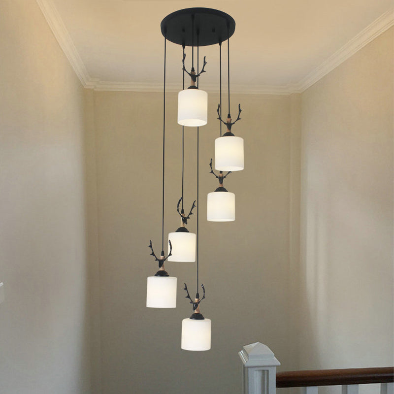 Modernism Cylinder Cluster Pendant Opal Glass Stairs Pendulum Light in Black with Round Canopy 6 White C Clearhalo 'Ceiling Lights' 'Modern Pendants' 'Modern' 'Pendant Lights' 'Pendants' Lighting' 2025678