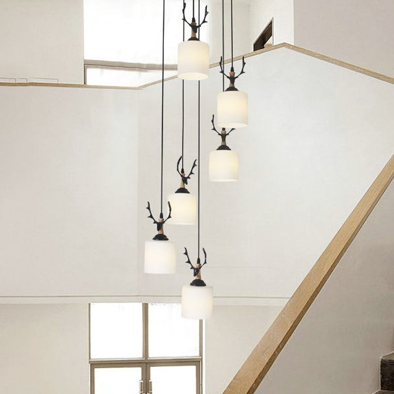 Modernism Cylinder Cluster Pendant Opal Glass Stairs Pendulum Light in Black with Round Canopy Clearhalo 'Ceiling Lights' 'Modern Pendants' 'Modern' 'Pendant Lights' 'Pendants' Lighting' 2025680
