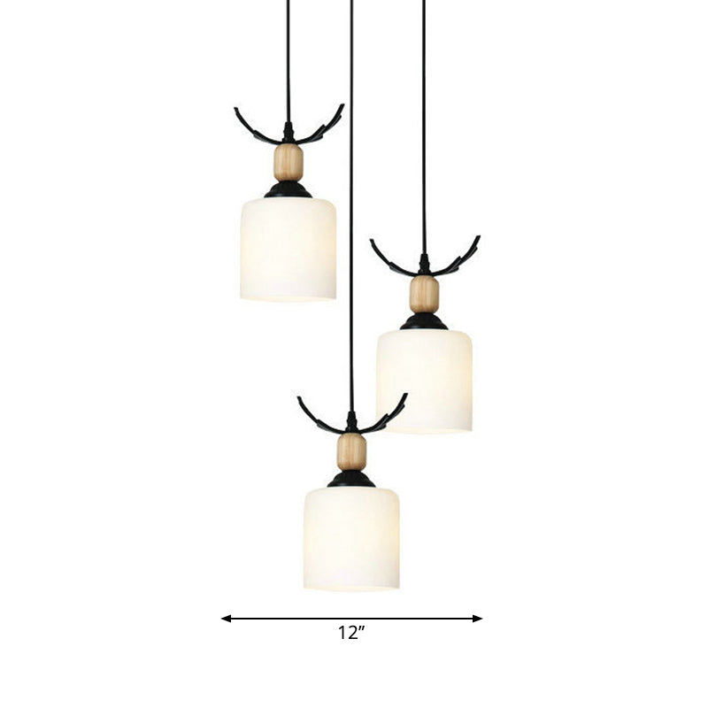 Modernism Cylinder Cluster Pendant Opal Glass Stairs Pendulum Light in Black with Round Canopy Clearhalo 'Ceiling Lights' 'Modern Pendants' 'Modern' 'Pendant Lights' 'Pendants' Lighting' 2025686