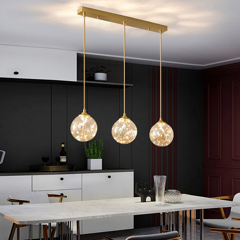 Modern Sphere Ceiling Pendant Glass Dining Room LED Suspension Lamp in Brass Clearhalo 'Ceiling Lights' 'Modern Pendants' 'Modern' 'Pendant Lights' 'Pendants' Lighting' 2025836