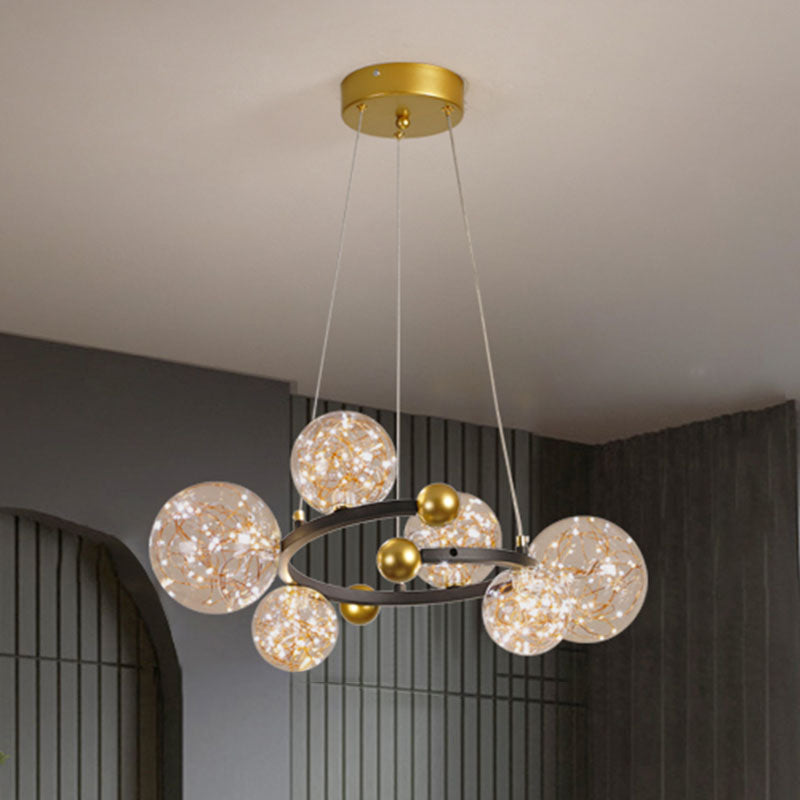 Clear Glass Orb Chandelier Lamp Contemporary LED Down Lighting with Glowing String 6 Gold-Black Clearhalo 'Ceiling Lights' 'Chandeliers' 'Glass shade' 'Glass' 'Modern Chandeliers' 'Modern' Lighting' 2025919