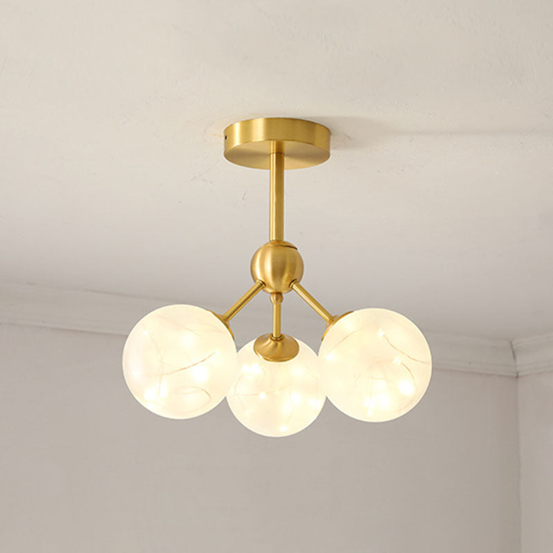 Simple LED Pendant Chandelier Brass Sphere Starry Hanging Lighting with Glass Shade 3 Cream Clearhalo 'Ceiling Lights' 'Chandeliers' 'Modern Chandeliers' 'Modern' Lighting' 2025986