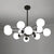Radial Living Room Hanging Chandelier Metal 12 Bulbs Simple Drop Pendant with Orb Opal Glass Shade in Black Black Clearhalo 'Ceiling Lights' 'Chandeliers' 'Glass shade' 'Glass' 'Modern Chandeliers' 'Modern' Lighting' 2039311