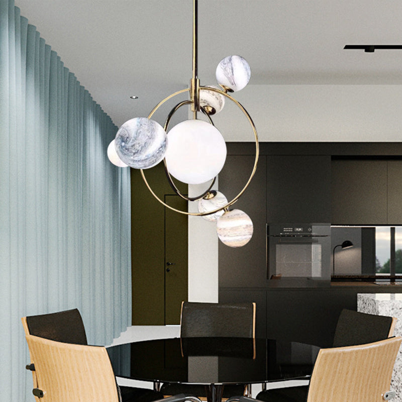 Simple Planet Orbit Drop Lamp Stained Glass 7-Head Dining Room Chandelier Light Fixture Gold Downrods Clearhalo 'Ceiling Lights' 'Chandeliers' 'Glass shade' 'Glass' 'Modern Chandeliers' 'Modern' Lighting' 2039411
