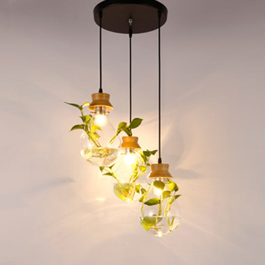 Clear Glass Bulb Shaped Suspension Lighting Rustic 3 Heads Restaurant Planter Multi Lamp Pendant Light 3 Black Round Clearhalo 'Ceiling Lights' 'Close To Ceiling Lights' 'Glass shade' 'Glass' 'Industrial Pendants' 'Industrial' 'Middle Century Pendants' 'Pendant Lights' 'Pendants' 'Tiffany' Lighting' 2063995