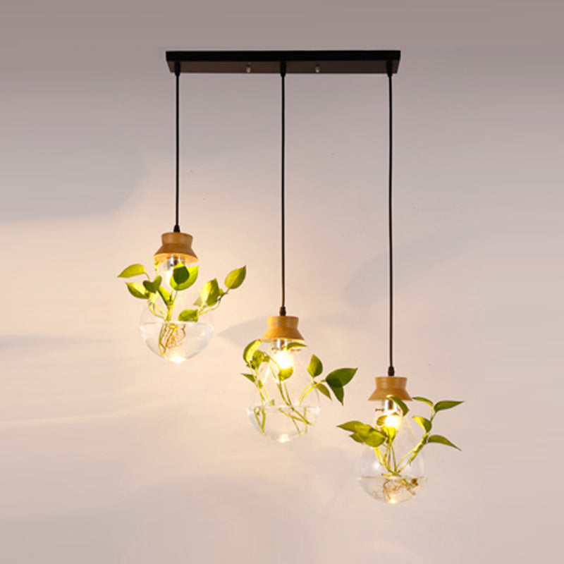 Clear Glass Bulb Shaped Suspension Lighting Rustic 3 Heads Restaurant Planter Multi Lamp Pendant Light Clearhalo 'Ceiling Lights' 'Close To Ceiling Lights' 'Glass shade' 'Glass' 'Industrial Pendants' 'Industrial' 'Middle Century Pendants' 'Pendant Lights' 'Pendants' 'Tiffany' Lighting' 2063999