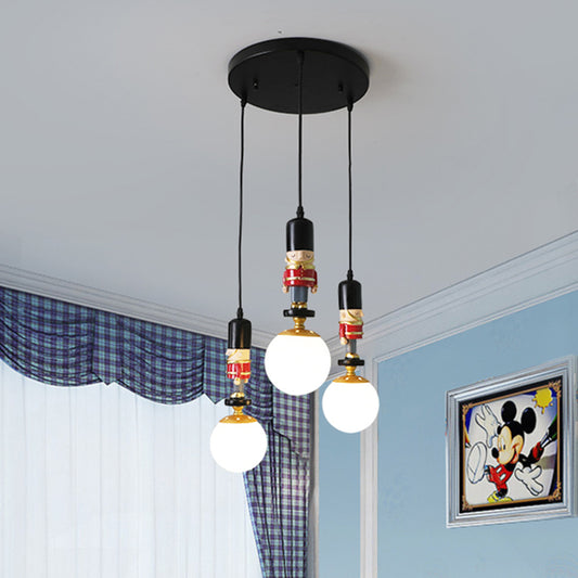 Sphere Shade Bedroom Multi Ceiling Light Cream Glass Kids Multi Light Pendant with Decorative Figurine 3 Black Clearhalo 'Ceiling Lights' 'Close To Ceiling Lights' 'Glass shade' 'Glass' 'Pendant Lights' 'Pendants' Lighting' 2187819