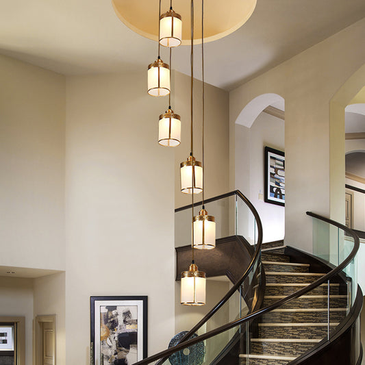 Artistic Cylindrical Multi Ceiling Light Frost Glass Staircase Suspension Lighting in Brass 6 Brass Clearhalo 'Ceiling Lights' 'Glass shade' 'Glass' 'Modern Pendants' 'Modern' 'Pendant Lights' 'Pendants' Lighting' 2197648