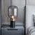 Postmodern Barrel Nightstand Lamp Glass 1-Light Bedside Table Lighting with Cylindrical Marble Base Black Clearhalo 'Lamps' 'Table Lamps' Lighting' 2197829