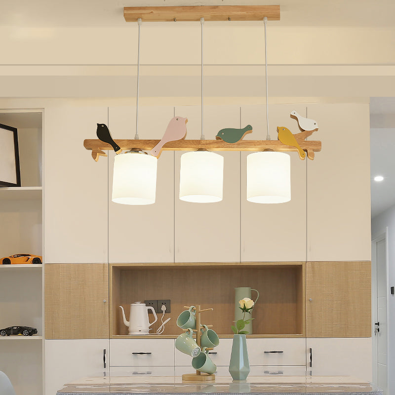 Cylindrical LED Hanging Lamp Simplicity Cream Glass Dining Room Island Chandelier Light with Wooden Bird Clearhalo 'Ceiling Lights' 'Island Lights' Lighting' 2228555