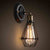 Single-Bulb Wall Mount Light Industrial Pear Cage Iron Wall Light Fixture in Black Black Clearhalo 'Art deco wall lights' 'Cast Iron' 'Glass' 'Industrial wall lights' 'Industrial' 'Middle century wall lights' 'Modern' 'Rustic wall lights' 'Tiffany' 'Traditional wall lights' 'Wall Lamps & Sconces' 'Wall Lights' Lighting' 2241606