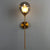 Nordic Ball Shaped Wall Light Glass 1-Bulb Entryway Sconce Lighting with Brass Pencil Arm Smoke Gray Clearhalo 'Cast Iron' 'Glass' 'Industrial' 'Modern wall lights' 'Modern' 'Tiffany' 'Traditional wall lights' 'Wall Lamps & Sconces' 'Wall Lights' Lighting' 2254487