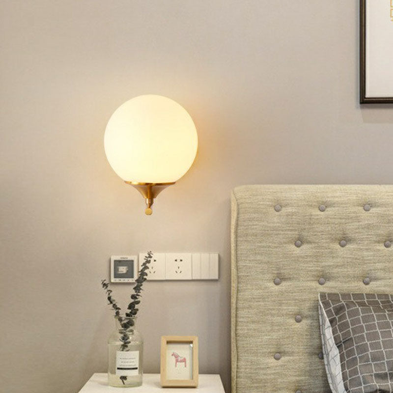 Sphere Bedside Wall Sconce Milk Glass 1-Light Minimalist Wall Mounted Light with Right Angle Arm in Gold Clearhalo 'Cast Iron' 'Glass' 'Industrial' 'Modern wall lights' 'Modern' 'Tiffany' 'Traditional wall lights' 'Wall Lamps & Sconces' 'Wall Lights' Lighting' 2254516