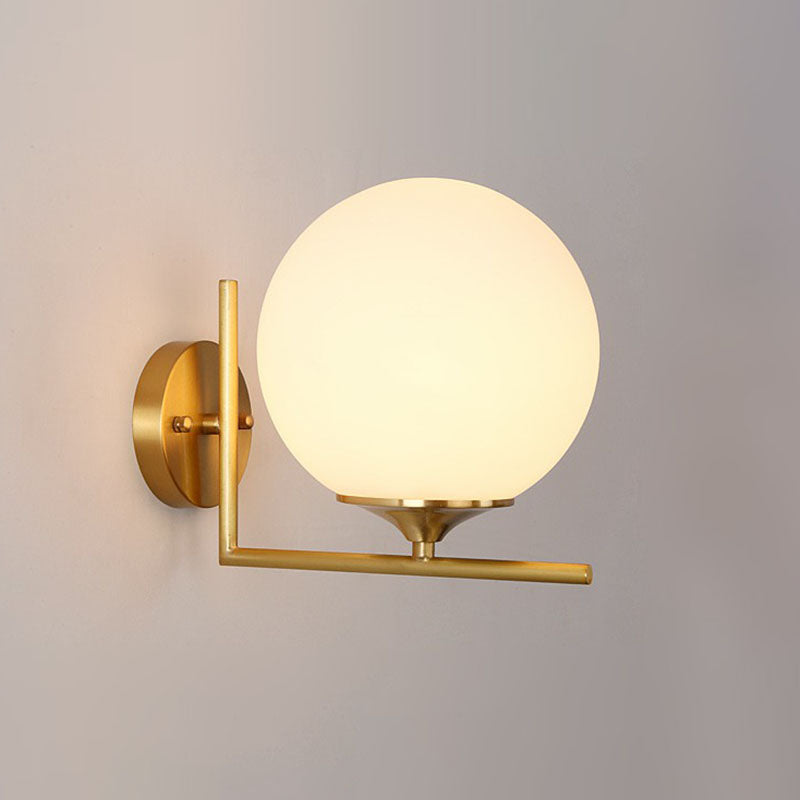 Sphere Bedside Wall Sconce Milk Glass 1-Light Minimalist Wall Mounted Light with Right Angle Arm in Gold Gold 8" Clearhalo 'Cast Iron' 'Glass' 'Industrial' 'Modern wall lights' 'Modern' 'Tiffany' 'Traditional wall lights' 'Wall Lamps & Sconces' 'Wall Lights' Lighting' 2254520