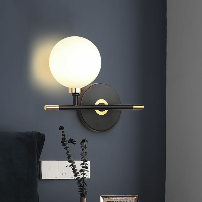 Ball Bedside Sconce Fixture Opaline Glass Contemporary Wall Mounted Light in Black Clearhalo 'Cast Iron' 'Glass' 'Industrial' 'Modern wall lights' 'Modern' 'Tiffany' 'Traditional wall lights' 'Wall Lamps & Sconces' 'Wall Lights' Lighting' 2254594