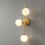 Designer Ball Wall Light Sconce Glass 3-Head Bedroom Wall Mounted Lighting in Brass White Clearhalo 'Cast Iron' 'Glass' 'Industrial' 'Modern wall lights' 'Modern' 'Tiffany' 'Traditional wall lights' 'Wall Lamps & Sconces' 'Wall Lights' Lighting' 2254627