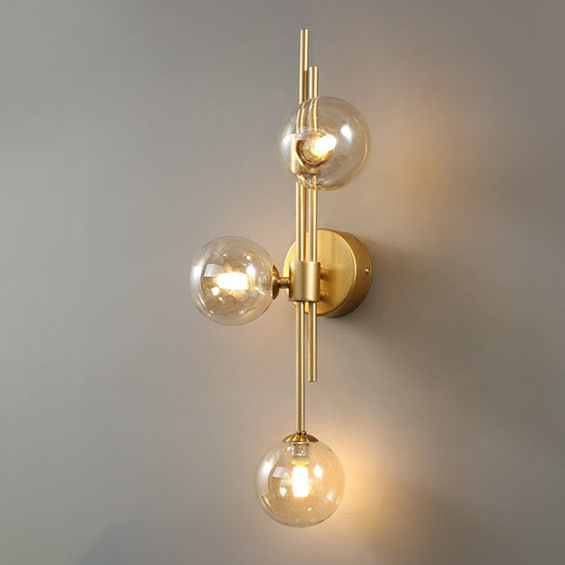 Designer Ball Wall Light Sconce Glass 3-Head Bedroom Wall Mounted Lighting in Brass Amber Clearhalo 'Cast Iron' 'Glass' 'Industrial' 'Modern wall lights' 'Modern' 'Tiffany' 'Traditional wall lights' 'Wall Lamps & Sconces' 'Wall Lights' Lighting' 2254628