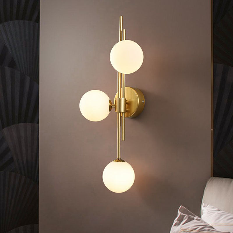 Designer Ball Wall Light Sconce Glass 3-Head Bedroom Wall Mounted Lighting in Brass Clearhalo 'Cast Iron' 'Glass' 'Industrial' 'Modern wall lights' 'Modern' 'Tiffany' 'Traditional wall lights' 'Wall Lamps & Sconces' 'Wall Lights' Lighting' 2254629