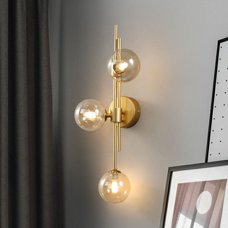 Designer Ball Wall Light Sconce Glass 3-Head Bedroom Wall Mounted Lighting in Brass Clearhalo 'Cast Iron' 'Glass' 'Industrial' 'Modern wall lights' 'Modern' 'Tiffany' 'Traditional wall lights' 'Wall Lamps & Sconces' 'Wall Lights' Lighting' 2254631