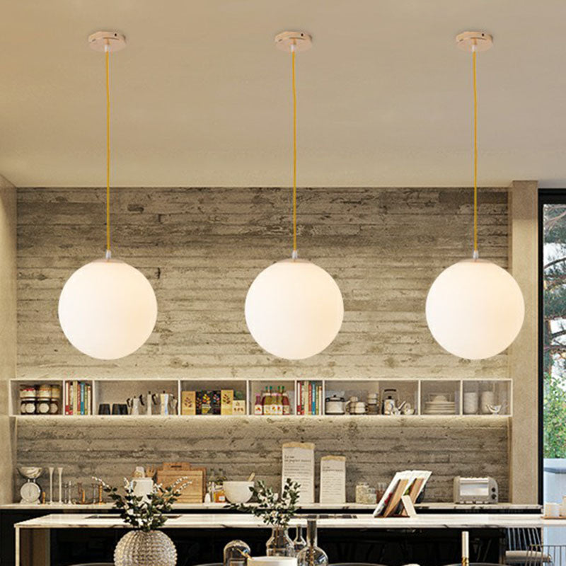 White Glass Spherical Suspension Lighting Minimalism 1 Head Ceiling Pendant Light over Table Clearhalo 'Ceiling Lights' 'Modern Pendants' 'Modern' 'Pendant Lights' 'Pendants' Lighting' 2254677