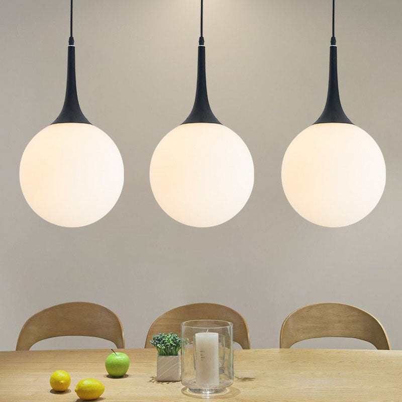 Spherical Cream Glass Suspension Light Minimalist 1-Light Hanging Pendant for Dining Room Black Clearhalo 'Ceiling Lights' 'Modern Pendants' 'Modern' 'Pendant Lights' 'Pendants' Lighting' 2254814