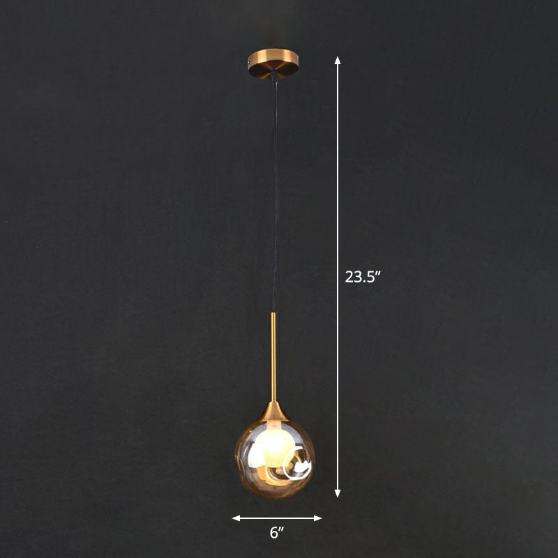 1 Head Bedside Pendant Light Postmodern Brass Ceiling Lamp with Ball Dimple Glass Shade Amber Clearhalo 'Ceiling Lights' 'Modern Pendants' 'Modern' 'Pendant Lights' 'Pendants' Lighting' 2254819