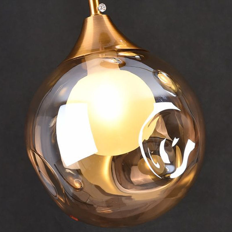 1 Head Bedside Pendant Light Postmodern Brass Ceiling Lamp with Ball Dimple Glass Shade Clearhalo 'Ceiling Lights' 'Modern Pendants' 'Modern' 'Pendant Lights' 'Pendants' Lighting' 2254821