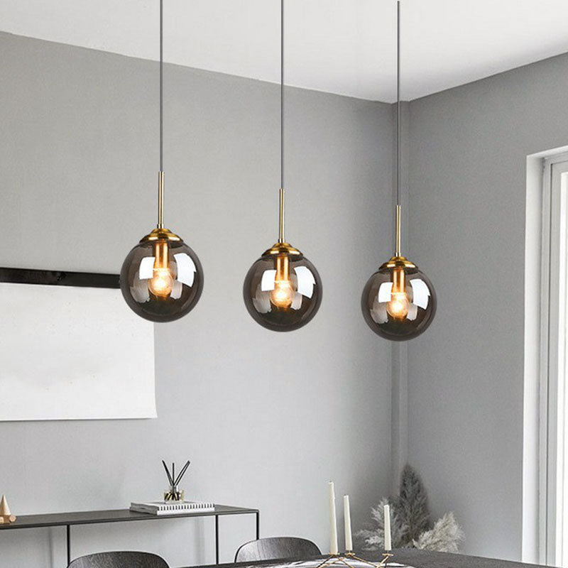 Minimalistic Spherical Multi Ceiling Light Glass 3-Bulb Dining Room Suspension Pendant in Brass Smoke Gray Clearhalo 'Ceiling Lights' 'Modern Pendants' 'Modern' 'Pendant Lights' 'Pendants' Lighting' 2266040