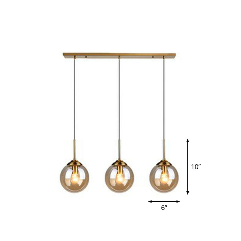 Minimalistic Spherical Multi Ceiling Light Glass 3-Bulb Dining Room Suspension Pendant in Brass Clearhalo 'Ceiling Lights' 'Modern Pendants' 'Modern' 'Pendant Lights' 'Pendants' Lighting' 2266042