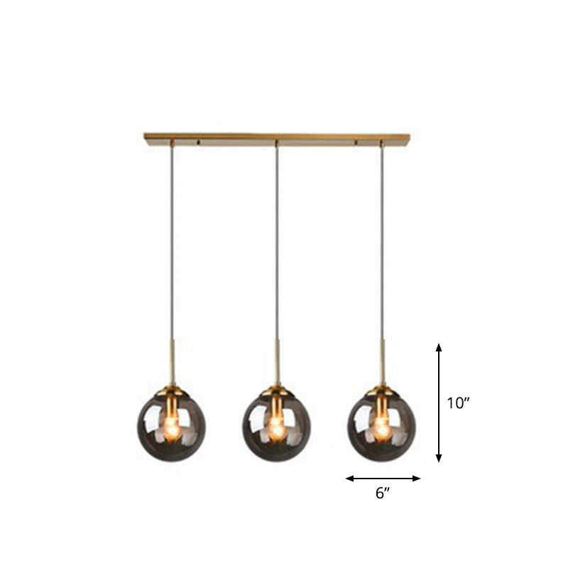 Minimalistic Spherical Multi Ceiling Light Glass 3-Bulb Dining Room Suspension Pendant in Brass Clearhalo 'Ceiling Lights' 'Modern Pendants' 'Modern' 'Pendant Lights' 'Pendants' Lighting' 2266043