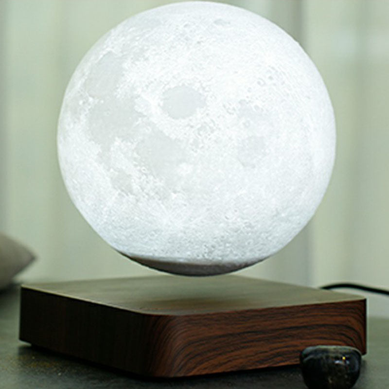 Magnetic Levitation Moon Shaped Night Light Novelty Kids Plastic LED Table Lamp with Square Wooden Base Brown Clearhalo 'Lamps' 'Table Lamps' Lighting' 2266122