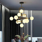 Glass 3D Atomic Chandelier Postmodern 12-Bulb Black and Brass Suspension Light Fixture Clearhalo 'Ceiling Lights' 'Chandeliers' 'Modern Chandeliers' 'Modern' Lighting' 2268430