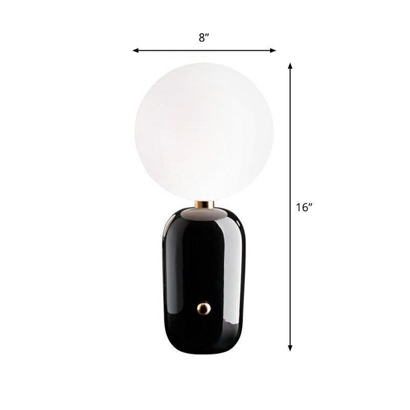 Capsule Base Night Table Light Postmodern Metal 1 Bulb Kids Room Nightstand Lamp with Orb White Glass Shade Black Medium Clearhalo 'Lamps' 'Table Lamps' Lighting' 2268645