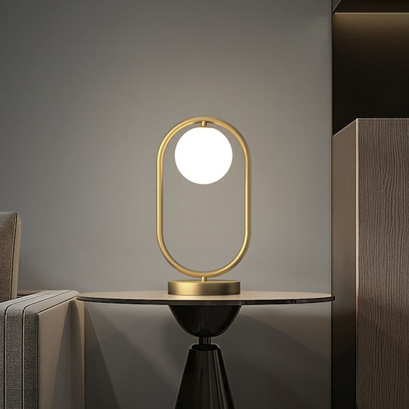Minimalist Oval Frame Table Lighting Metal 1-Head Bedroom Night Light with Ball Milk Glass Shade in Gold Clearhalo 'Lamps' 'Table Lamps' Lighting' 2268733