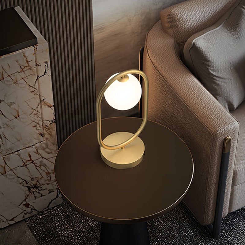 Minimalist Oval Frame Table Lighting Metal 1-Head Bedroom Night Light with Ball Milk Glass Shade in Gold Clearhalo 'Lamps' 'Table Lamps' Lighting' 2268734